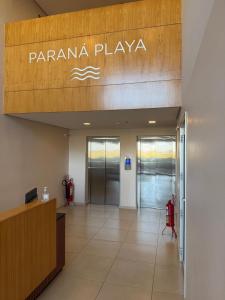 an entrance to a parma playa office with a lobby at Apartamento completamente equipado! Con Parking! En Paraná Playa Deptos! in Encarnación +44 photos