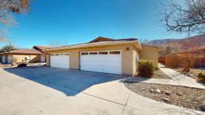 a house with two garage doors on a driveway at Canyon Portal #469 in Moab
