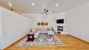 a living room with a couch and a fireplace at Canyon Portal #469 in Moab +41 photos