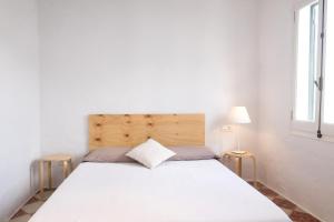 A bed or beds in a room at Cas Conco