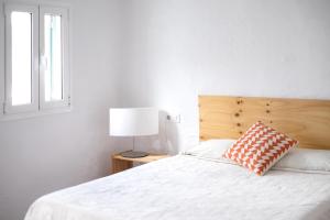 A bed or beds in a room at Cas Conco