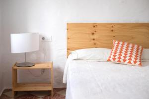 A bed or beds in a room at Cas Conco
