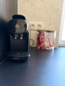 a coffee maker sitting on top of a counter at Au pied du mur in Huy
