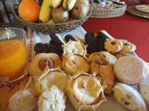 a bunch of donuts and other foods on a table at B&B Mare E Natura in Cuile Ezi Mannu