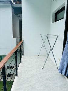 a view of a balcony with a metal railing at Hillside Haven-Luxury Room in Nathon Bay +32 photos