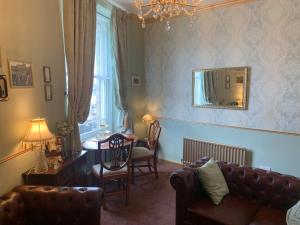 a living room with a couch and a table at Downton I in Alnwick