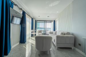 a living room with a couch and a chair at Elite World Homes Istanbul Bosphorus in Istanbul