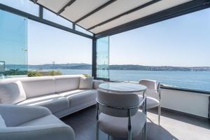 a living room with a couch and a table at Elite World Homes Istanbul Bosphorus in Istanbul