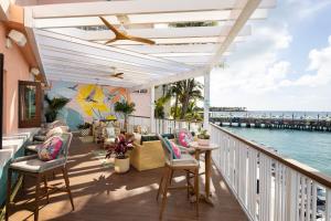 a balcony with chairs and a view of the ocean at Ocean Key Resort & Spa, a Noble House Resort in Key West