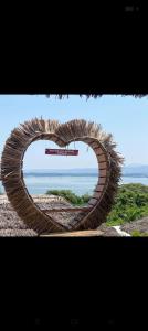 a sculpture of a circle with a view of the ocean at Sky Beach Resort Ltd in Kisumu