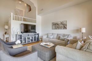 a living room with two couches and a tv at Fire Pit & Large Yard! Luxury Anthem Escape in Anthem