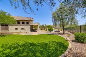 a yard with a green lawn and a house at Fire Pit & Large Yard! Luxury Anthem Escape in Anthem