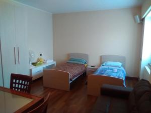 A bed or beds in a room at Maison d'Elite