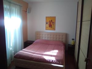 A bed or beds in a room at Maison d'Elite