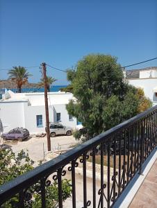 a balcony with a view of a parking lot at Benigna Studios in Leipsoi