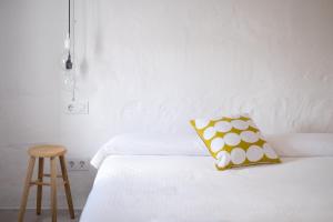 A bed or beds in a room at Cas Conco
