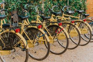 a row of yellow bikes parked next to each other at Hotel Miramare in Forte dei Marmi