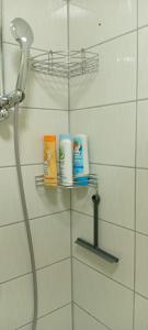 a bathroom with a shelf with toiletries on it at Apartment S&S Tomislavgrad in Tomislavgrad +8 photos