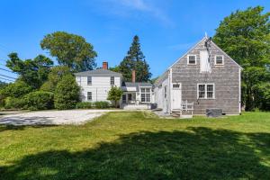 a large white house with a large yard at Featured in Cape Cod Life Magazine in Barnstable