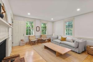 a living room with a couch and a coffee table at Featured in Cape Cod Life Magazine in Barnstable +38 photos