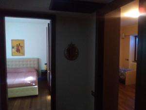 A bed or beds in a room at Maison d'Elite