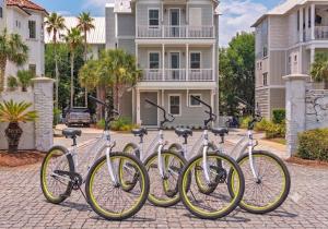 a row of bikes parked in front of a building at Mermaid Cove in Inlet Beach