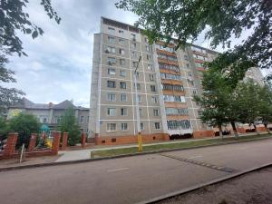 a large apartment building on the side of a street at Премиум квартира в современном стиле in Līsakovsk