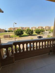 a balcony with a view of a street at Royal Green Haven 3BR Apartment near Airport Obour in Obour