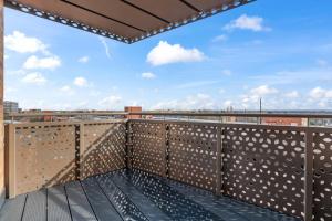 a rooftop deck with a view of the city at Thameside Suite | Free Parking | 2 BR | Heathrow in Staines