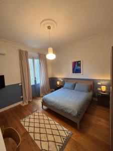 a bedroom with a bed and a large window at Casa Lucibell in Prato