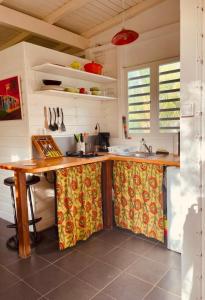a kitchen with a wooden counter top in a room at Kaz Menard in Saint-Louis +11 photos