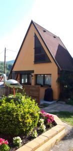 a house with a bird statue in front of it at Gite Pinot Blanc n°3 à Kaysersberg in Kaysersberg +8 photos
