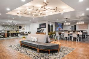 a living room with a couch and a dining room at Best Western Plus Grant Creek Inn in Missoula