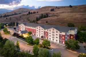 an aerial view of a hotel with a hill in the background at Best Western Plus Grant Creek Inn in Missoula