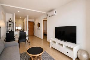a living room with a large flat screen tv at Condado de Alhama - Suchan living in El Romero