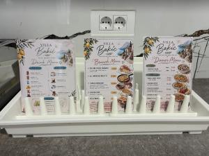 a display of milk bbq food signs on a table at Villa Bakic in Dobra Voda