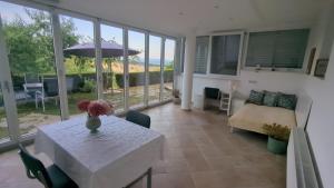 a living room with a table and a couch at Apartma pri Boru in Ptuj
