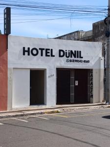 a hotel dunit sign on the side of a building at Hotel Dunil in Araguaína