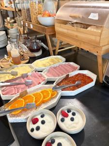 a buffet with many different types of food on a table at Autor Guesthouse in Vila do Conde