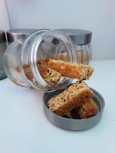 a container with two pieces of bread sticks in it at Cosy Stay in Robertson +17 photos
