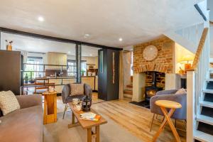 a living room with a couch and a fireplace at 3 Bed in Eype oc-e34183 in West Bay