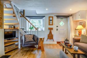 a living room with a staircase and a couch at 3 Bed in Eype oc-e34183 in West Bay