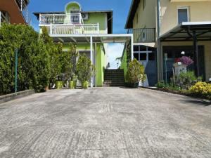 an empty driveway in front of a house at Apartmani Cirkov in Veliko Gradište +3 photos