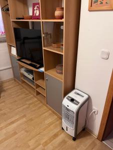 a room with a heater in the corner of a closet at Apartma Ob Krki in Straža