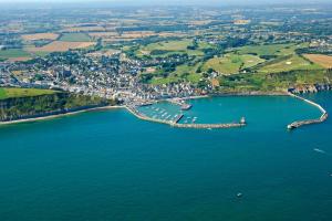 an aerial view of a harbor with boats in the water at Fenêtre sur Mer I CAP MER in Port-en-Bessin-Huppain