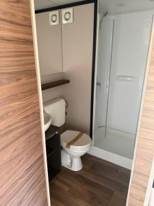 a bathroom with a toilet and a shower at simami resort in Caldarola