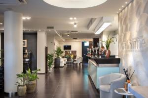 a lobby of a restaurant with a bar at Hotel Marad in Torre del Greco