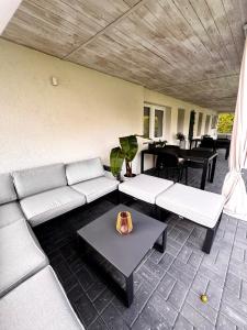 a living room with a couch and a table at Domek pod Jabłonią in Barzowice
