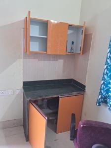 a room with a desk in a room with a chair at Aadyasha in Pānchagān