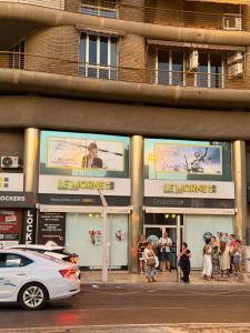 a group of people standing outside of a building at Akasa Rooms Estación in Alicante